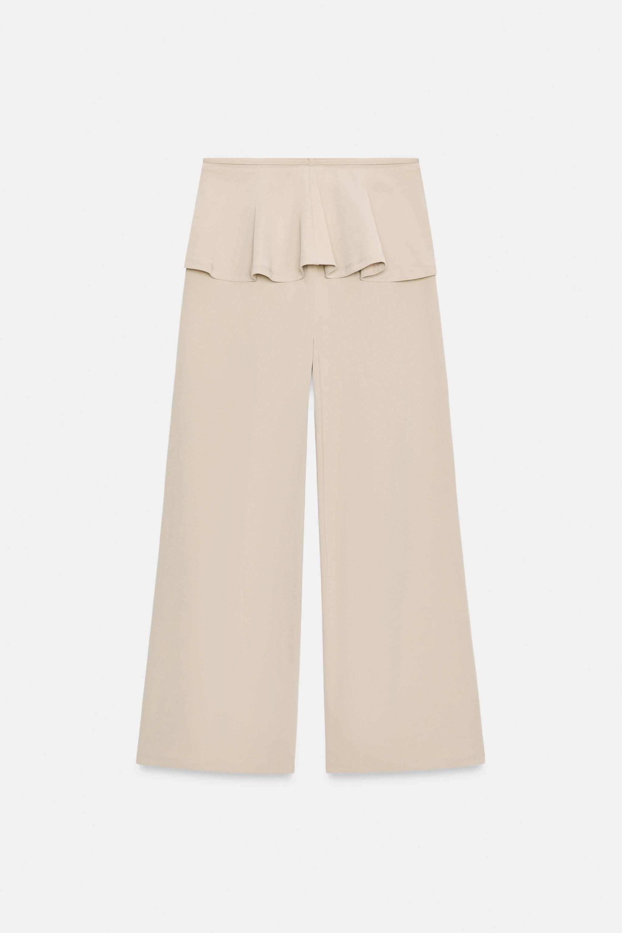 PANTALON LARGE À VOLANT LA TAILLE